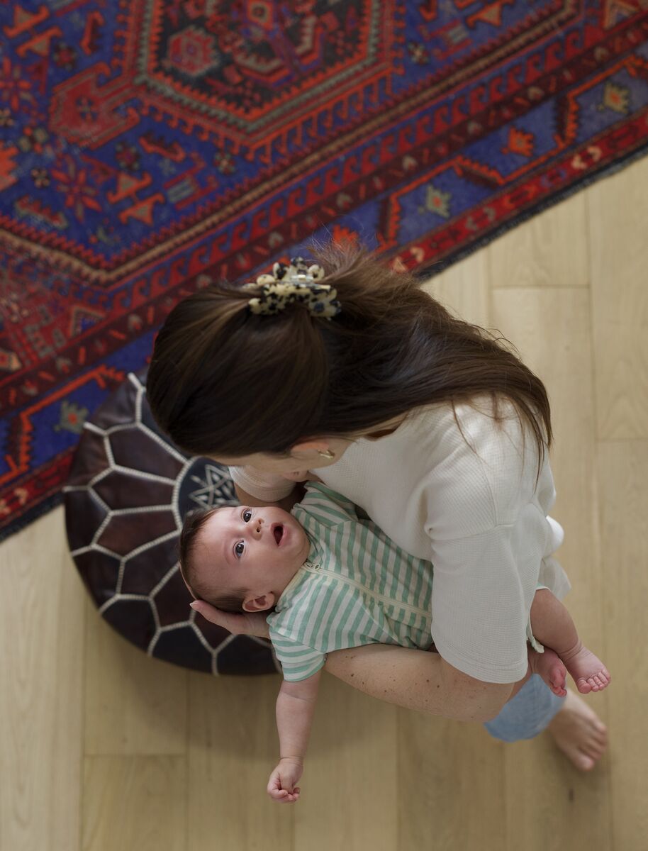 Overhead view of mother kissing her baby